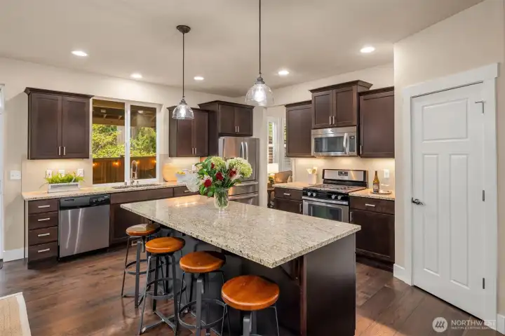 Quality finishes grace the kitchen with gas range and walk in pantry.
