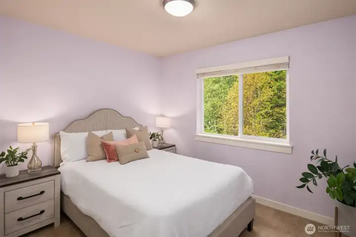 2nd bedroom with views of patio and green belt.