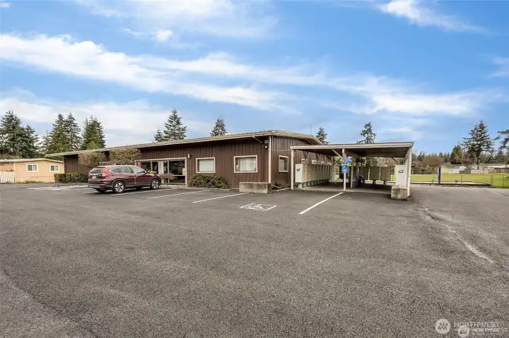 Main office and club house with covered mailboxes to the left.