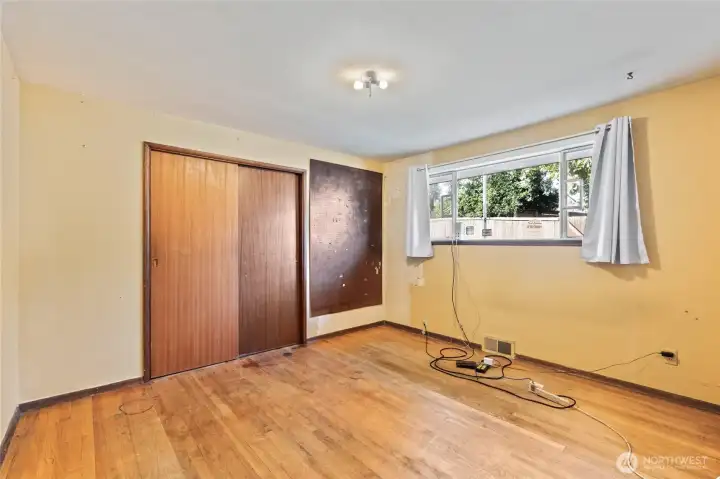 Good sized bedroom with hardwood floors.