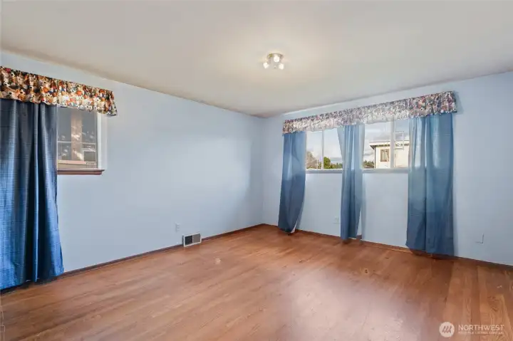 2nd bedroom on the main. It is also good sized with hardwood floors.