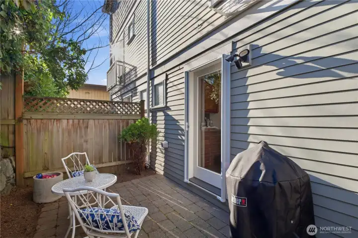 Let’s head outside for outdoor space number two, great for quiet mornings, gardening, or entertaining on the patio.