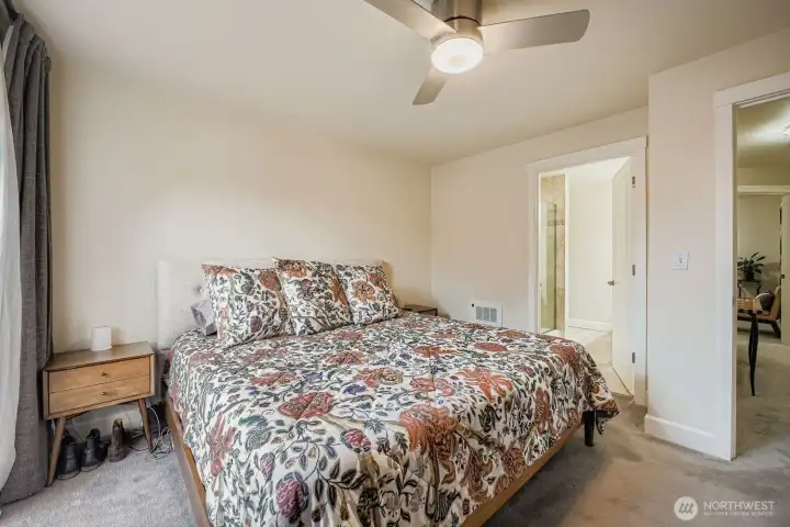 Primary bath boasts marble appointments and a dual shower.