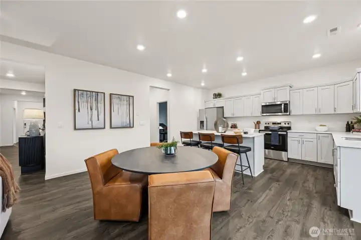 Space for both informal and formal dining areas. Photo is representational. Actual home is under construction and colors, materials, and finishes may vary. See site agent for details.