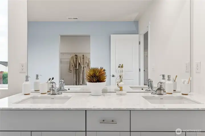 Primary bathroom features double vanity and step in shower. Photo is representational. Actual home is under construction and colors, materials, and finishes may vary. See site agent for details.
