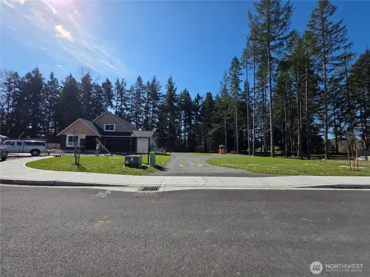 Lot 18 showing no home on one side. Borders community park