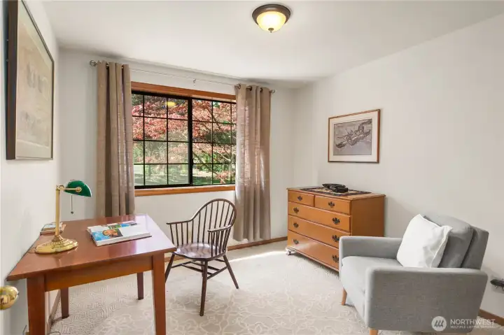 First bedroom looks out to the front yard. There is a closet too.