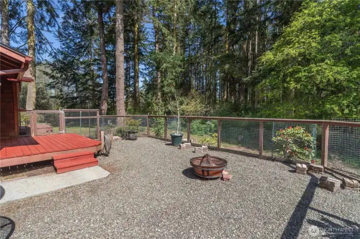 fenced area. Not shown here is a door to the garage and a fenced area with the propane tank for the fireplace.