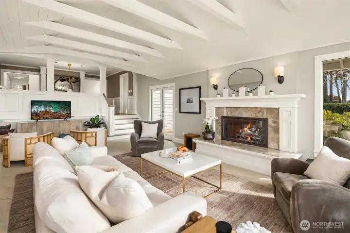 This isn't your mother's living room.  it is a fabulous flex entertaining space.  It connects out to a great outdoor deck allowing for seamless connection to indoor outdoor entertaining.  Great for a crowd to watch your favorite movies or games and enjoy the view too!