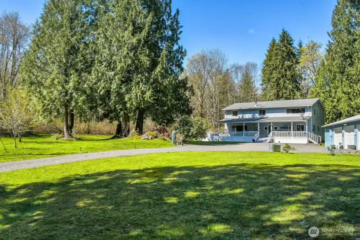 Down a Country Lane Nestled on 5 Parklike Acres!