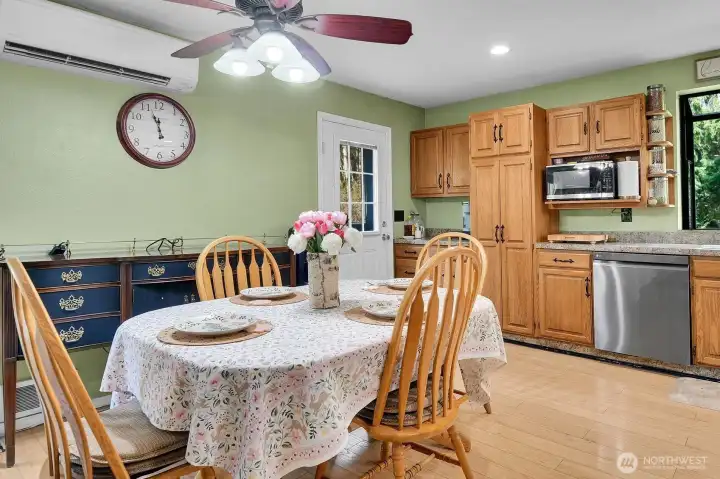 Country-Style Dining - Kitchen features Wood Floors, Solid Wood Cabinets, Like-new Stainless Appliances, Farm-Style Sink!
