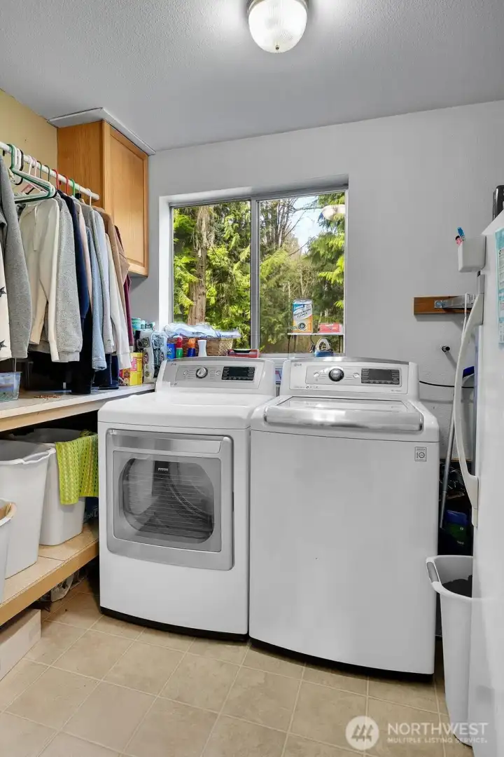 Mainfloor Laundry - for convenience Upstairs offers a Laundry to Shoot Too!