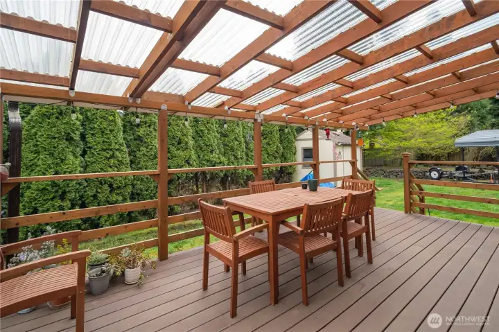 Covered rear deck with table for outdoor eating