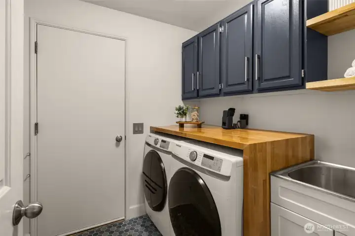 Laundry Room with Sink through Garage