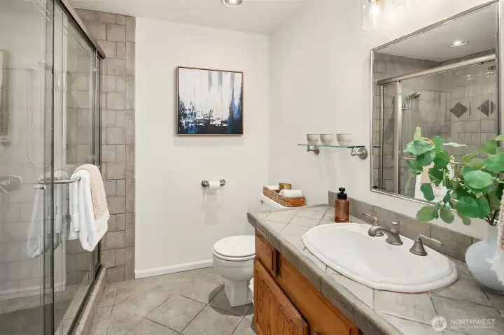 Primary bathroom with generous walk-in shower.