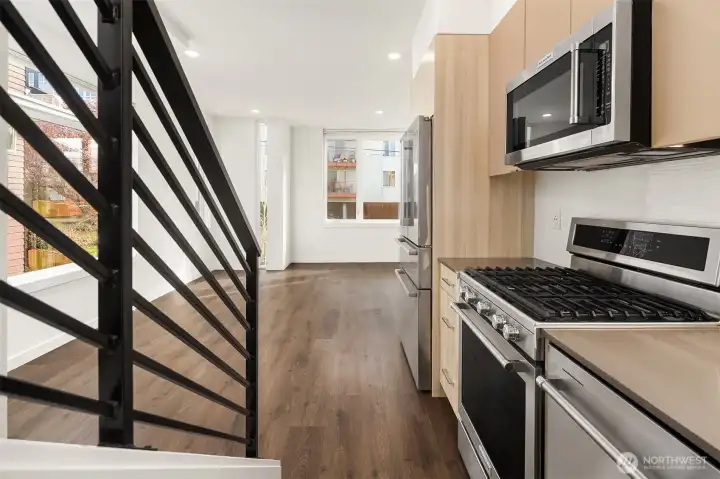 Kitchen flowing seamlessly into main living space. Kitchen flowing seamlessly into main living space.