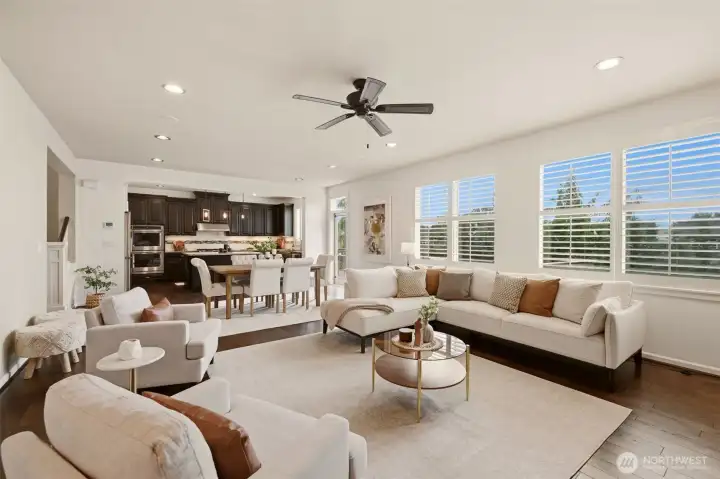 Spacious and bright great room with walls of windows Spacious and bright great room with walls of windows