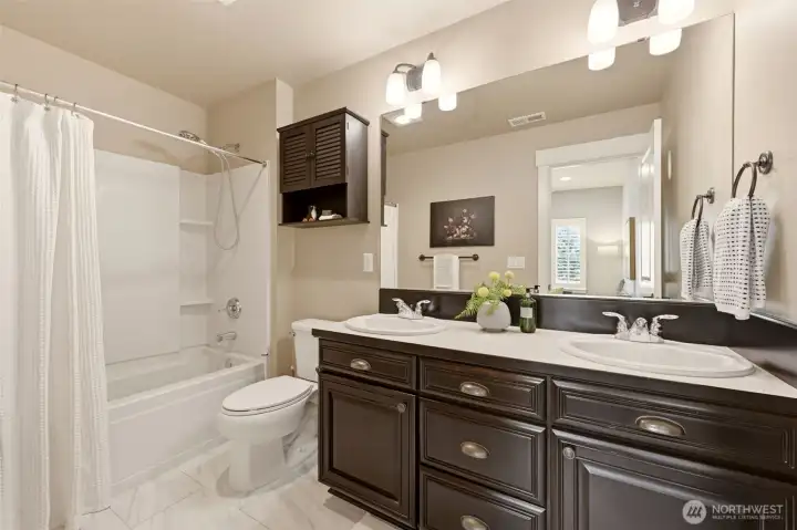 Hallway bathroom with double sinks on upper level Hallway bathroom with double sinks on upper level