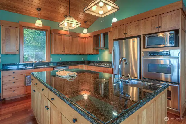Large granite island for meal prep and serving.