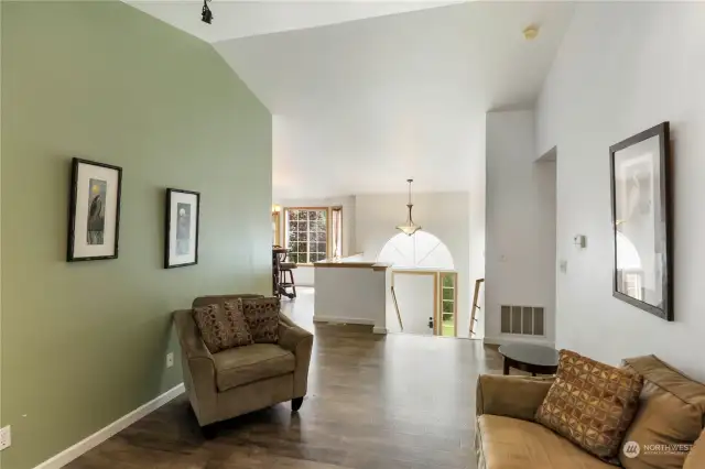 Tasteful colors and beautiful floors highlight the main living space.