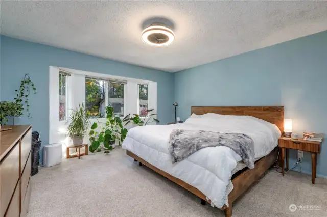 Large Primary Bedroom floods with light from the bay window!