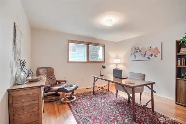 On the main floor is a room currently staged as an office but since it features a closet, is actually a bedroom!