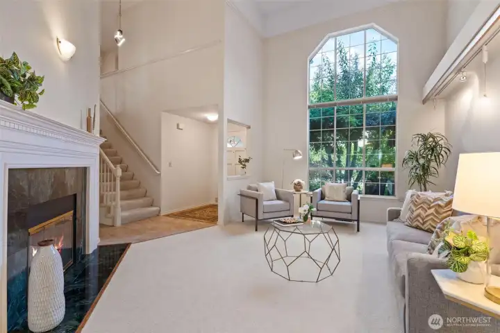 Front entry with large picture window, vaulted ceilings and gas fireplace.