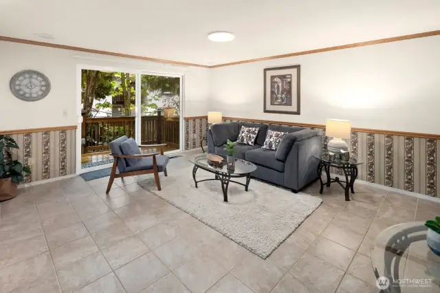 Additional living space on main floor with new sliding door leading to large and private back deck.