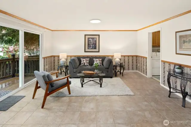 Additional living space on main floor with new sliding door leading to large and private back deck.