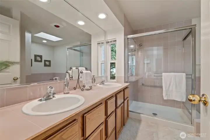 5 piece primary bathroom with jetted soaking tub.