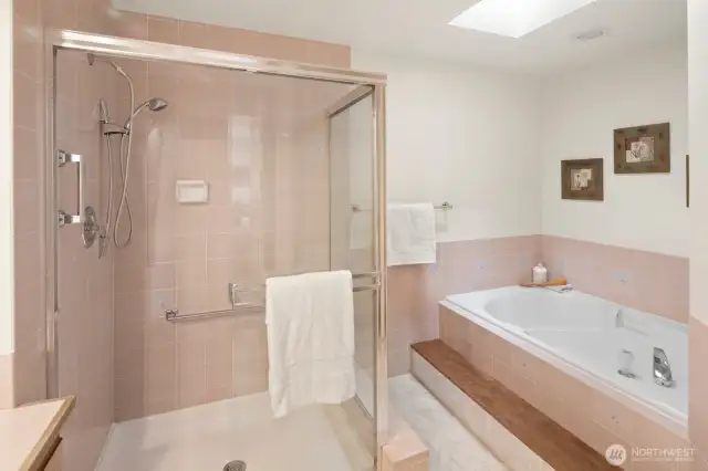 5 piece primary bathroom with jetted soaking tub.