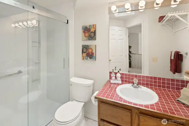 Main floor guest bathroom with new shower and glass enclosure.