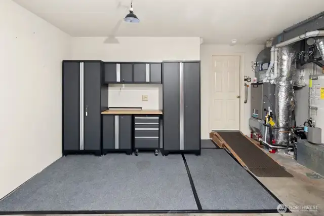 Garage cabinet unit, additional storage closet, window, upgraded gas utilities with AC and air cleaner.