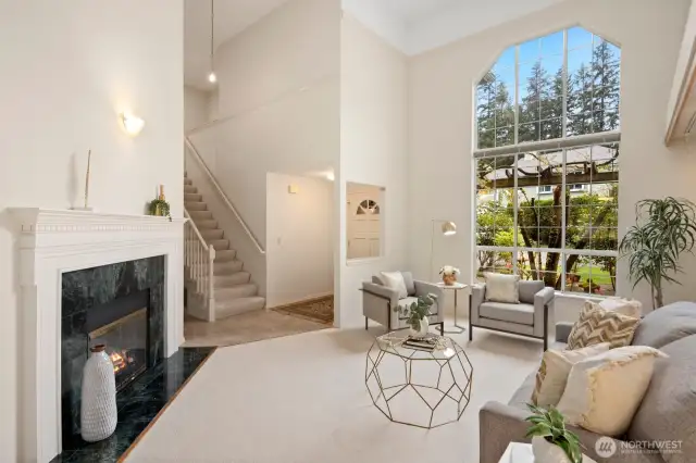 Front entry with large picture window, vaulted ceilings and gas fireplace.