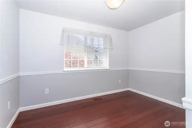 From the upper landing is another bedroom with chair rail design.
