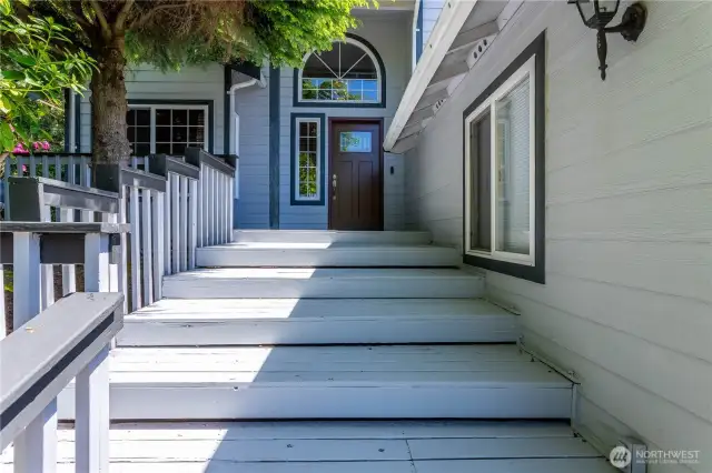 Wide front steps with hand rail