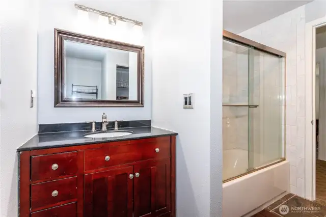 Main bathroom has full tub/shower and 1 sink.