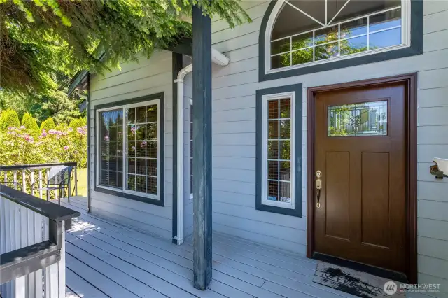 Front door with view of shaded front deck