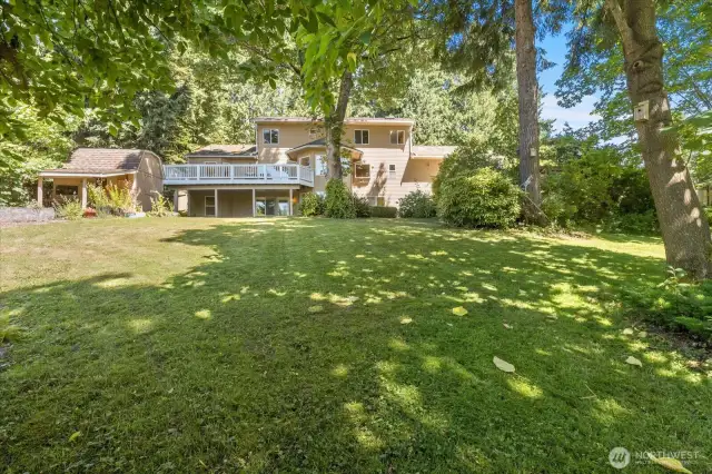 Nestled on a rare 1.3 acres, this impressive home offers space, privacy, and incredible potential. The main residence is generously sized, with classic lines and solid construction, perfect for multi-generational living or future customization. The walk out basement offers the ideal setup for a potential ADU—guest quarters, rental income, or a private home office. Surrounded by open land, mature trees, and natural beauty, this property combines the freedom of rural living with the comfort of a substantial home. A truly unique opportunity to create your dream estate.