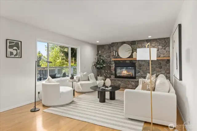 Easy-care Swedish-finish oak hardwood floors flow throughout the great room and main floor day rooms, offering a warm, durable, and seamless foundation that enhances the home's natural light and open feel.