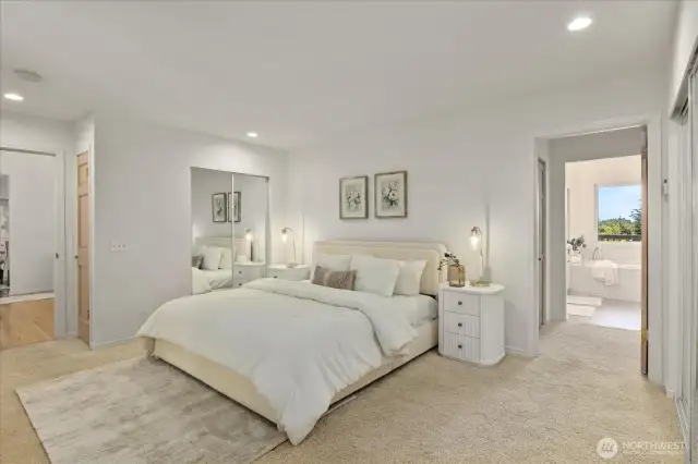 The main-floor primary suite is a serene sanctuary featuring two spacious closets for plenty of storage and organization. This well-appointed retreat offers privacy and comfort, making it the perfect place to unwind at the end of the day.