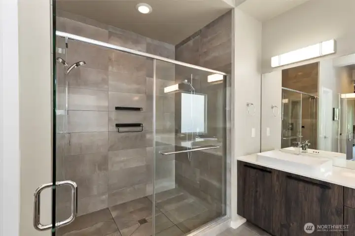 Luxury Spa shower with double shower heads and full tile walls