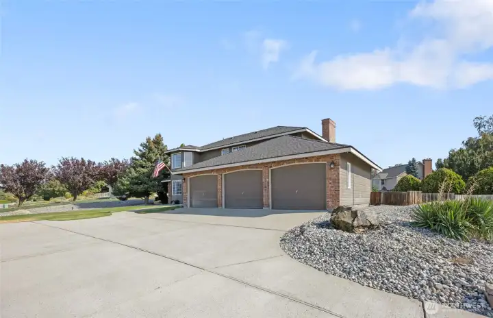 This home sits proud, just above the street- giving it both an inviting and grand presence