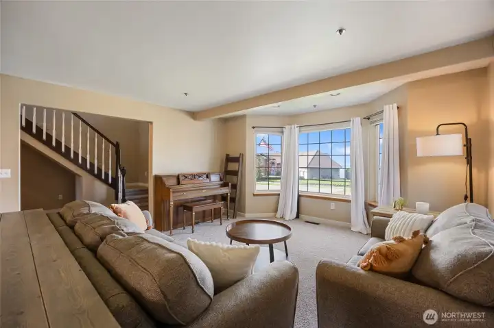 Formal living room with views of the river, city, mountains