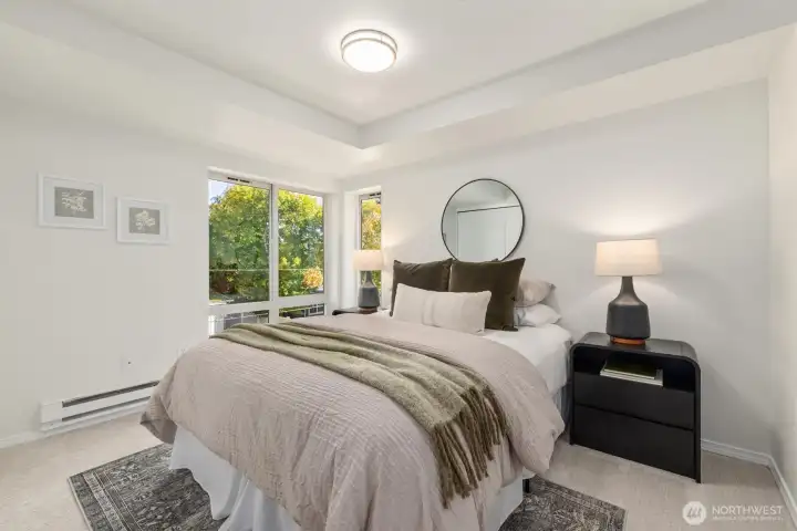Light and bright, private bedroom accommodates a queen bed or larger