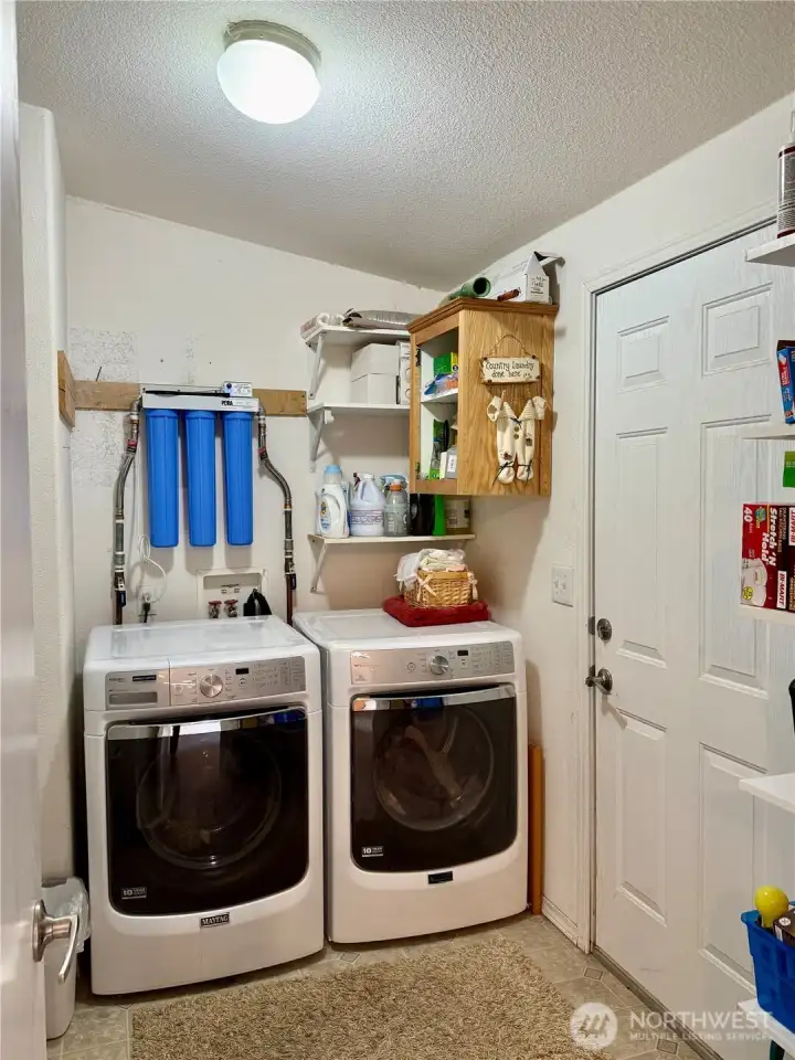 Utility Room with Exterior Access and Access to a Full Bath