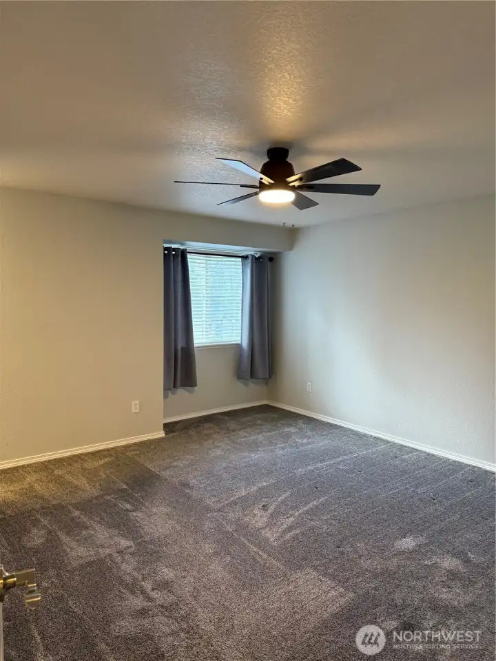 upstairs primary with walk in closet