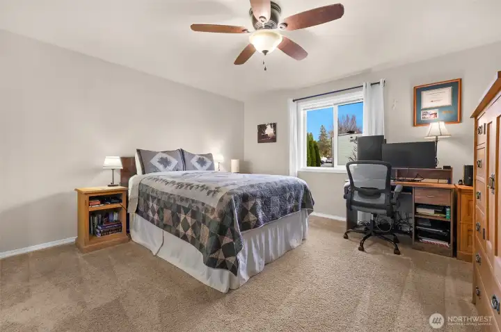 Spacious primary bedroom with private full bathroom & walk-in closet
