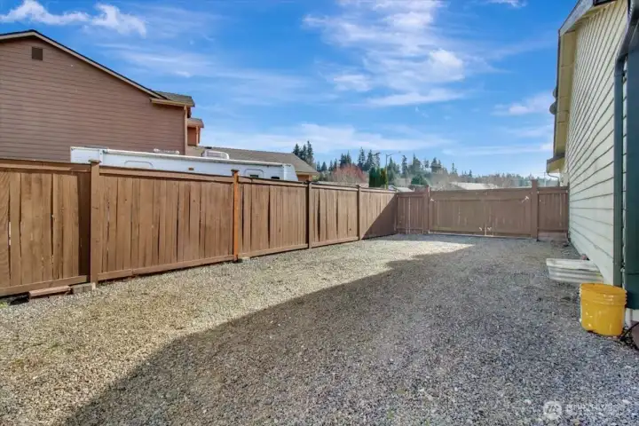 Behind gate gravel parking pad