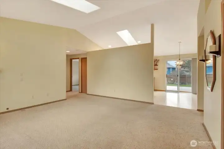 Vaulted ceilings opening to kitchen space